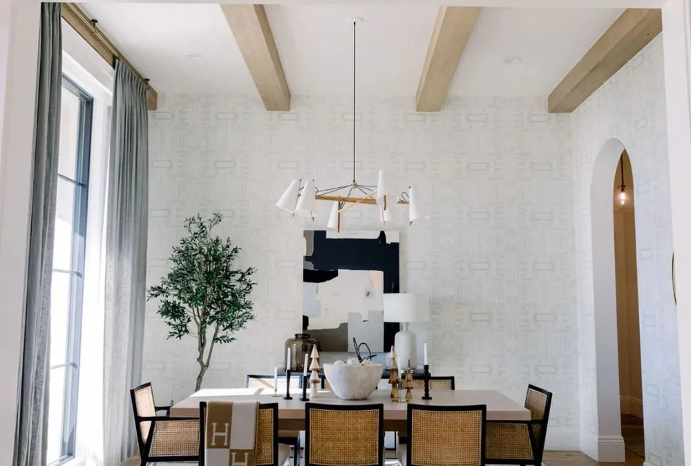Dining room with beams and arched window
