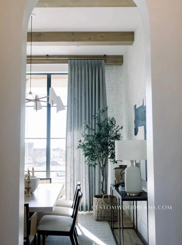 Dining room window wall with ceiling beams