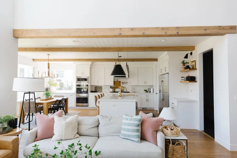 Open living room with light wood beams