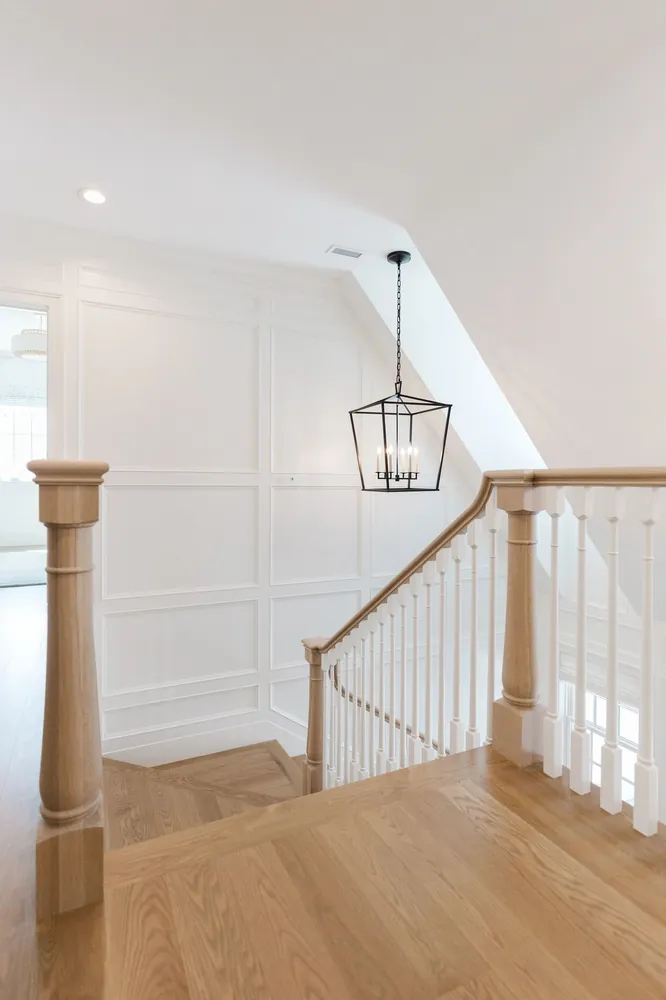 Stairway with a solid wood newel post
