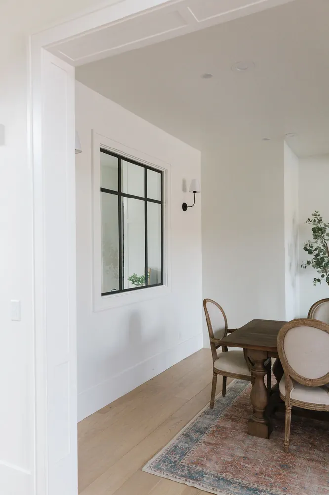 Dining nook with window and paneling