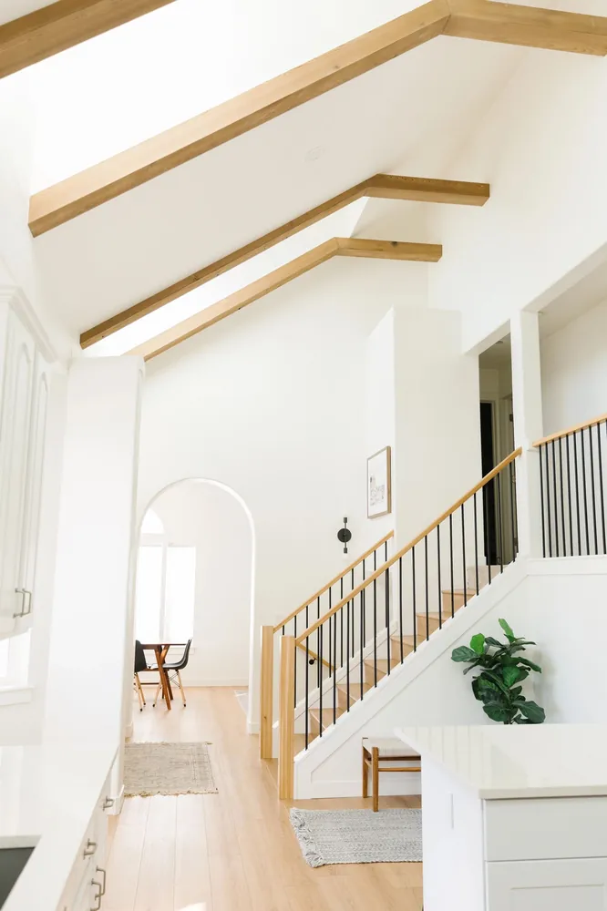 Vaulted hallway with exposed wood beams