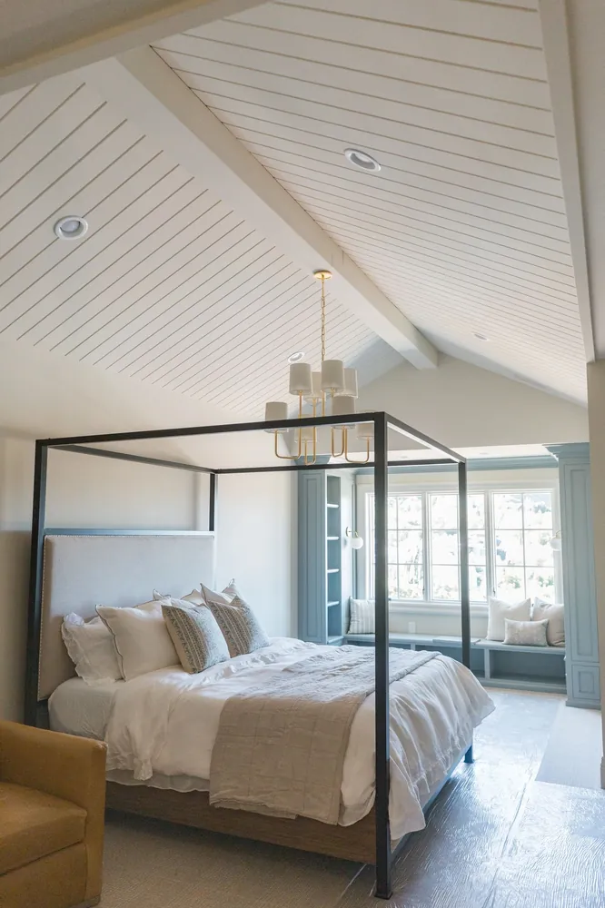 Bedroom with a vaulted shiplap ceiling