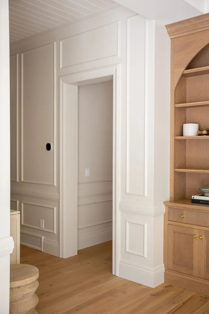 Paneled doorway beside built-in cabinets