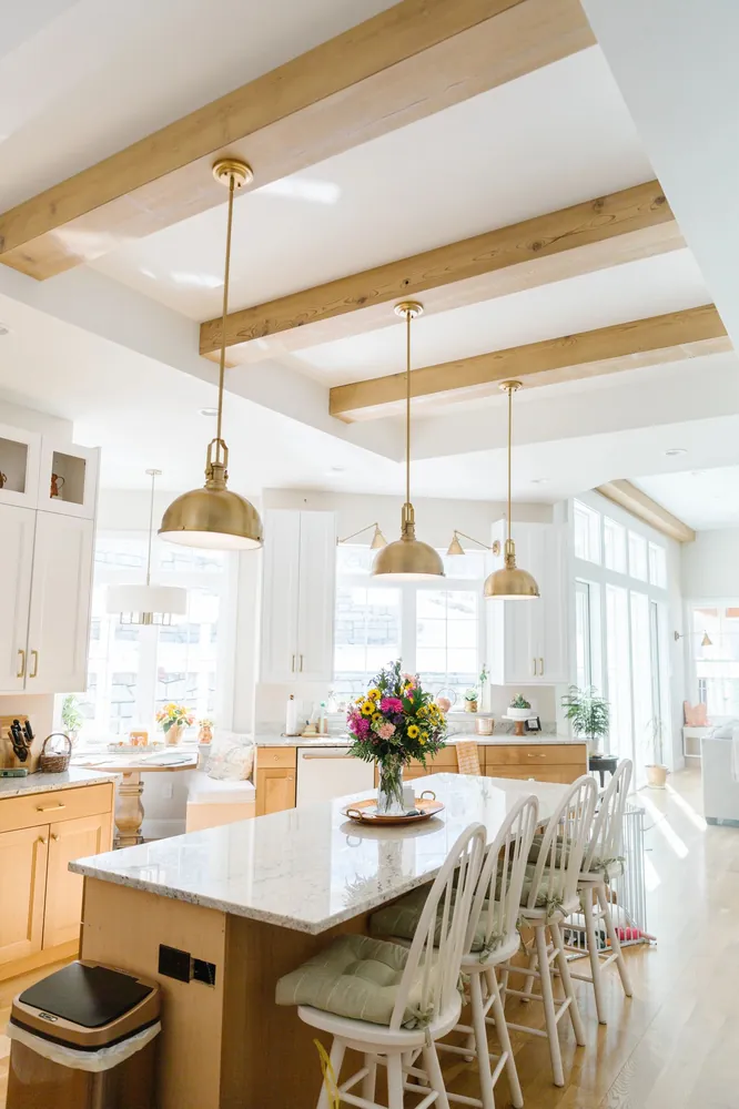 Kitchen with light wood ceiling beams