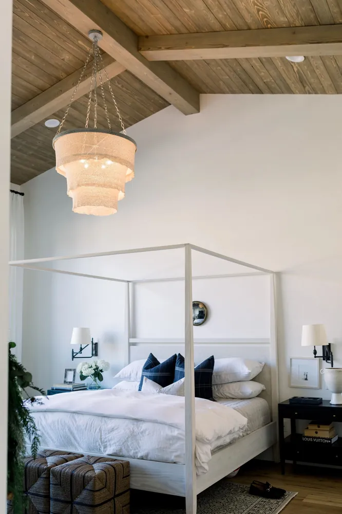 Bedroom with dark stained ceiling beams